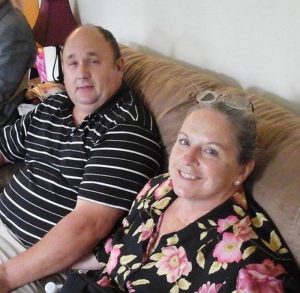 Steven and Elizabeth Rhodes are shown in a family photo. She is recovering from smoke inhalation and burns at Maine Medical Center. The fire's cause has not been determined.