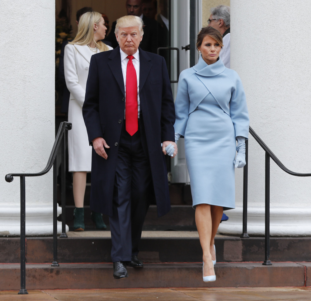 President-elect Donald Trump and his wife Melania walk out together after attending church service at St. John's Episcopal Church across from the White House in Washington, Friday, Jan. 20, 2017. (AP Photo/Pablo Martinez Monsivais)