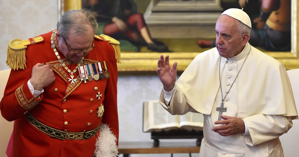 Pope Francis delivers his blessing during his meeting with Grand Master of the Knights of Malta Matthew Festing at the Vatican in June. The Knights of Malta is still insisting on its sovereignty in its showdown with the Vatican, even after Pope Francis effectively took control of the ancient religious order and announced a papal delegate would govern it through a "process of renewal."