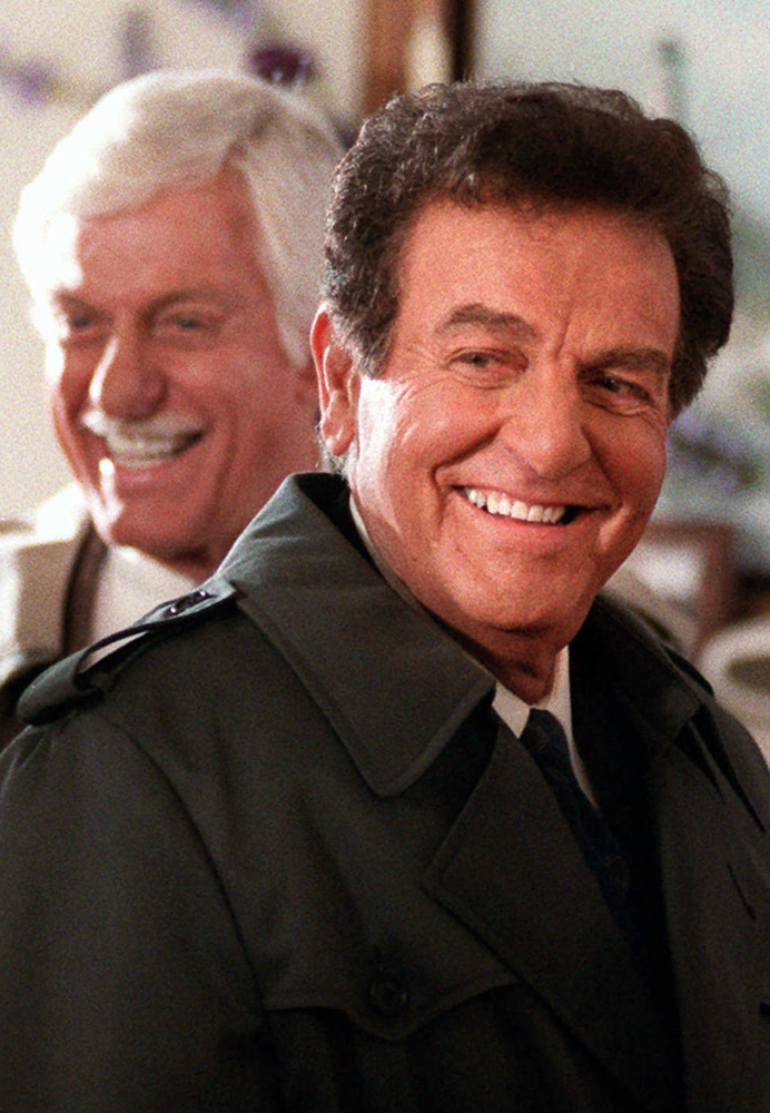 Mike Connors, right, appears with Dick Van Dyke in an episode of the television show "Diagnosis Murder." Connors died Thursday at the age of 91.