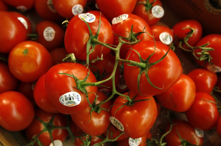 Tomatoes are seen in the produce section at a grocery store in Des Moines, Iowa. Associated Press file photo/Charlie Neibergall