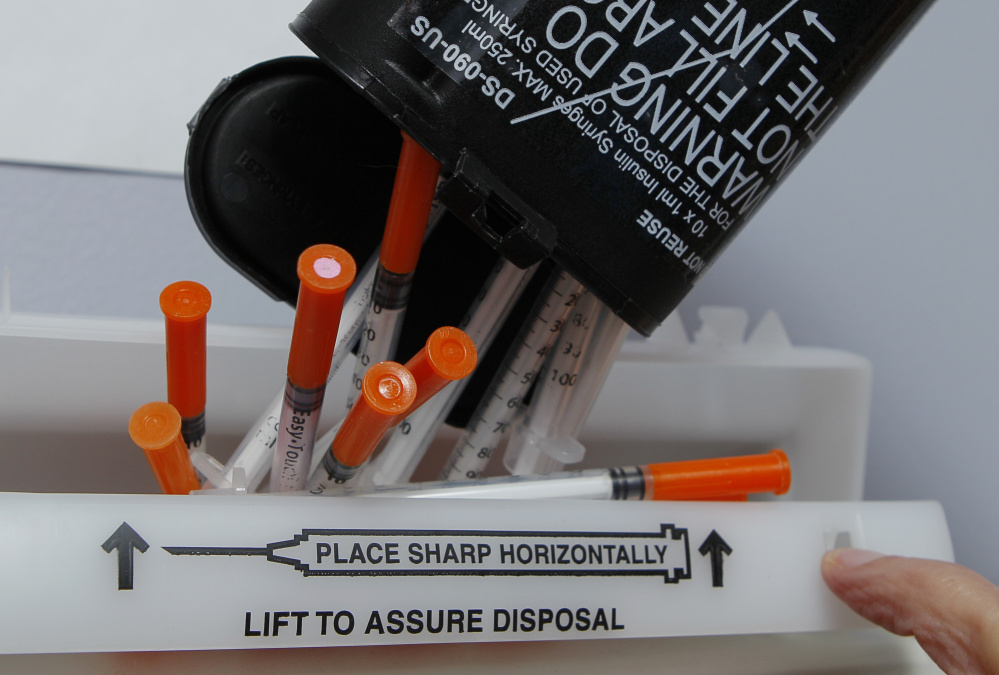 Hypodermic needles are disposed of at a clinic. On Friday, officials in Seattle approved the nation's first "safe injection" sites, where IV drug users can get clean needles and inject.