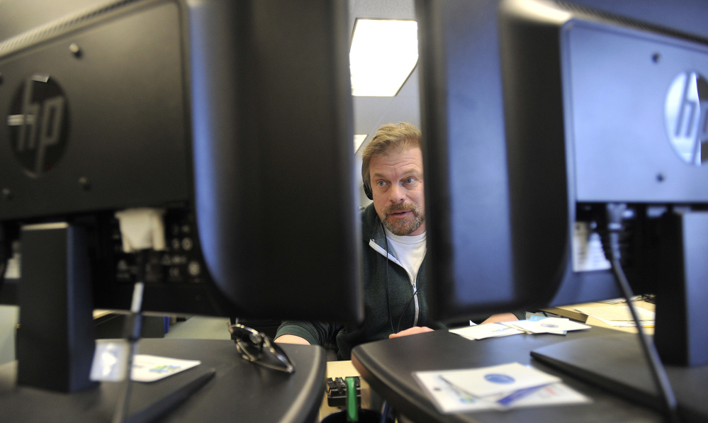 Reporter Fred Bever works in the newsroom at Maine Public Radio on Friday. 