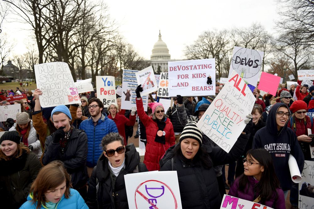 A crowd rallies Sunday on Capitol Hill to protest the nomination of Betsy DeVos as secretary of education. Similar protests took place over the weekend in Portland, Ore., Nashville and Holland, Mich., DeVos' hometown.