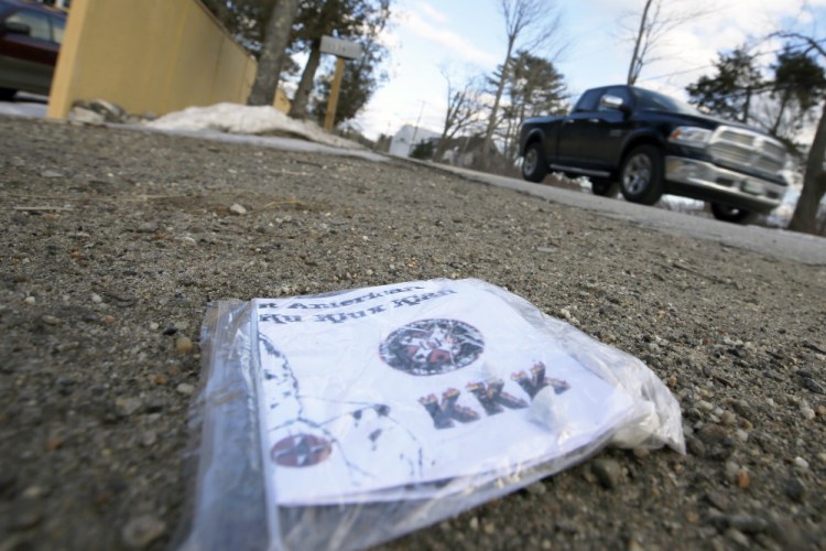 A truck passes near one of about two dozen Ku Klux Klan fliers left in driveways on South Freeport Road.