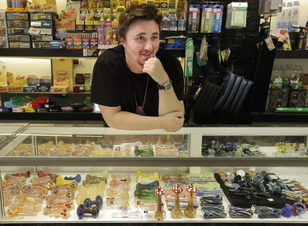 Sam Putnam, an employee at Awear in Portland, talks about the first day of legal marijuana in Maine. "It's nice not to have to worry," Putnam said. "People are more comfortable now than they were before."