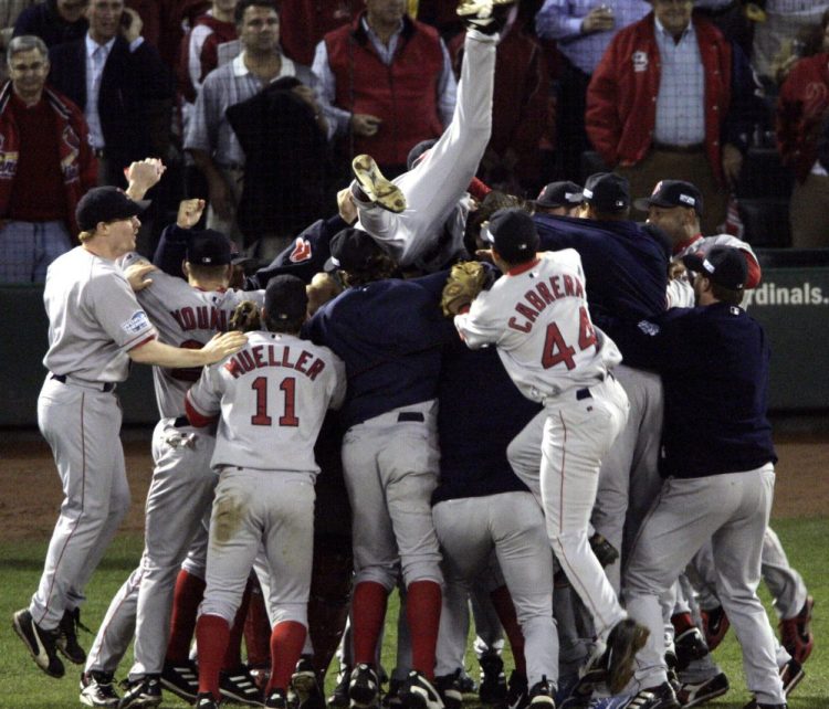 The Boston Red Sox celebrate after beating the St. Louis Cardinals 3-0 in Game 4 to sweep the 2004 World Series against St. Louis. The championship – the first for the Red Sox in 86 years – is at the top of Tom Caron's list.