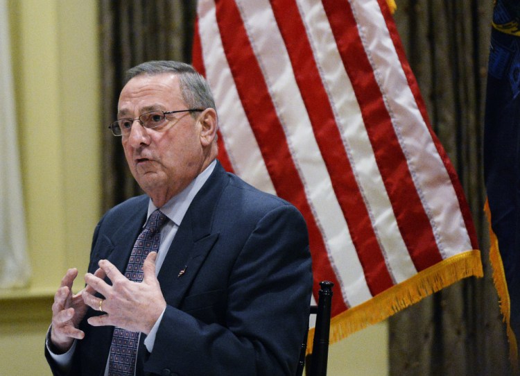 Gov. Paul LePage speaks to an audience of about 200 people at his town hall meeting Tuesday night in York. He said he doesn't oppose raising Maine's minimum wage, but the increases prescribed in the ballot initiative that voters passed in November will drive up prices and ultimately hurt Maine’s elderly.
