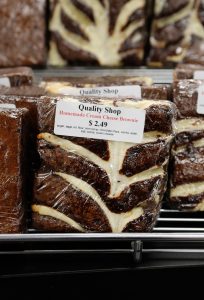 Homemade cream cheese brownies are among the many foods offered at the Quality Shop to appeal to 21st century tastes.