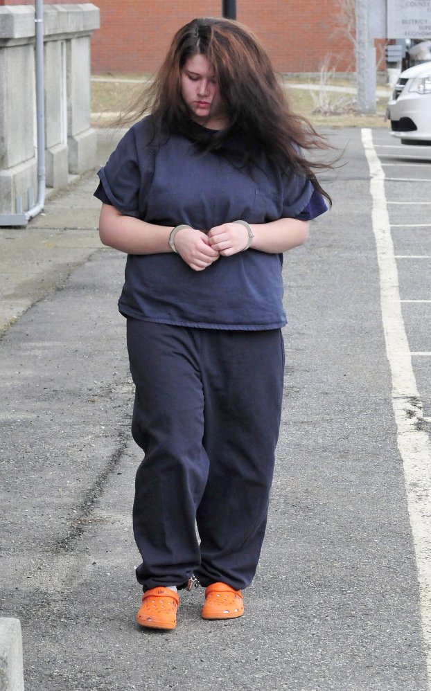 Kayla Stewart of Fairfield is led into Somerset County Superior Court in Skowhegan for an appearance in March.