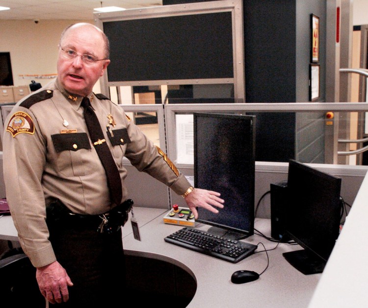 Somerset County Sheriff Dale Lancaster discusses on Thursday how objects smuggled illegally inside an inmate are detected on a monitor after the inmate passes through a body scanner at the county jail in East Madison.