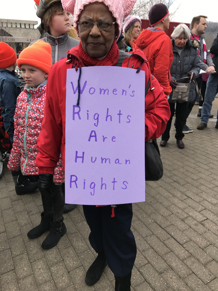 Lovye Oesterlin takes part Saturday in the Women's March on Maine at the State House in Augusta.