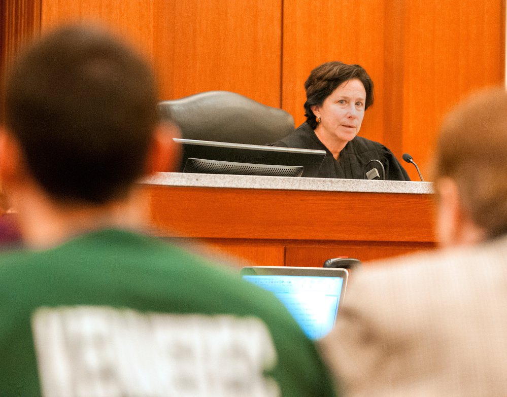 Mark D. Halle, left, and his attorney, Pamela Ames, right, listen as Justice Michaela Murphy, center, speaks during a hearing Thursday at the Capital Judicial Center in Augusta, where Halle withdrew his previous guilty pleas because he disagreed with the length of the sentence the judge said she would impose.