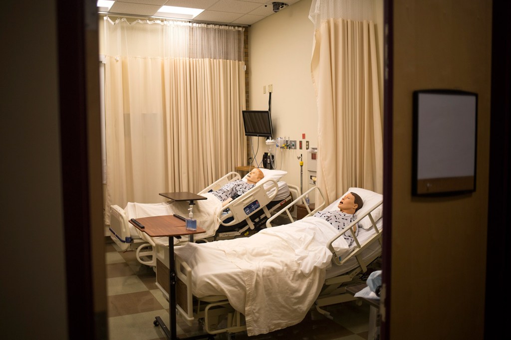 SIM dummies lie in a simulated hospital room at St. Joseph's College. The college will build four more SIM learning rooms with grant money from the Harold Alfond Foundation.