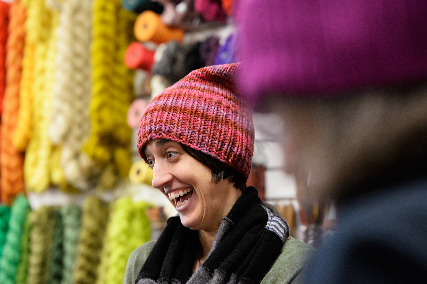 Wearing a pink pussy hat, Casey Ryder of Portland laughs with a spinning group at PortFiber on Thursday. Women are knitting the hats to wear to the Women's March on Washington on Jan. 21, and Ryder is planning to march.