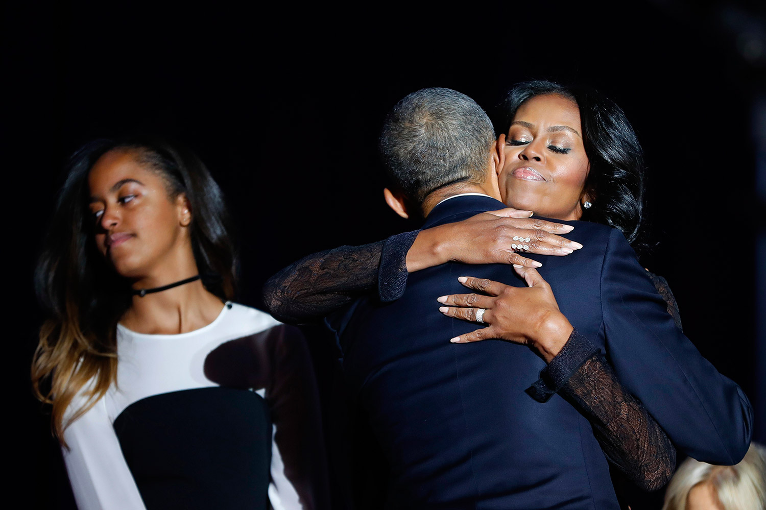 The Obamas hug after his farewell address, next to their daughter Malia. Associated Press/Pablo Martinez Monsivais
