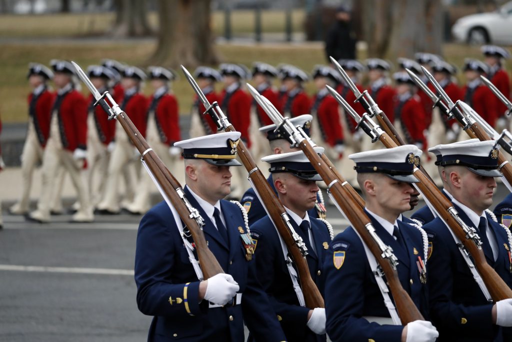 Military units march in the inaugural parade from the U.S. Capitol on Friday in Washington, D.C.