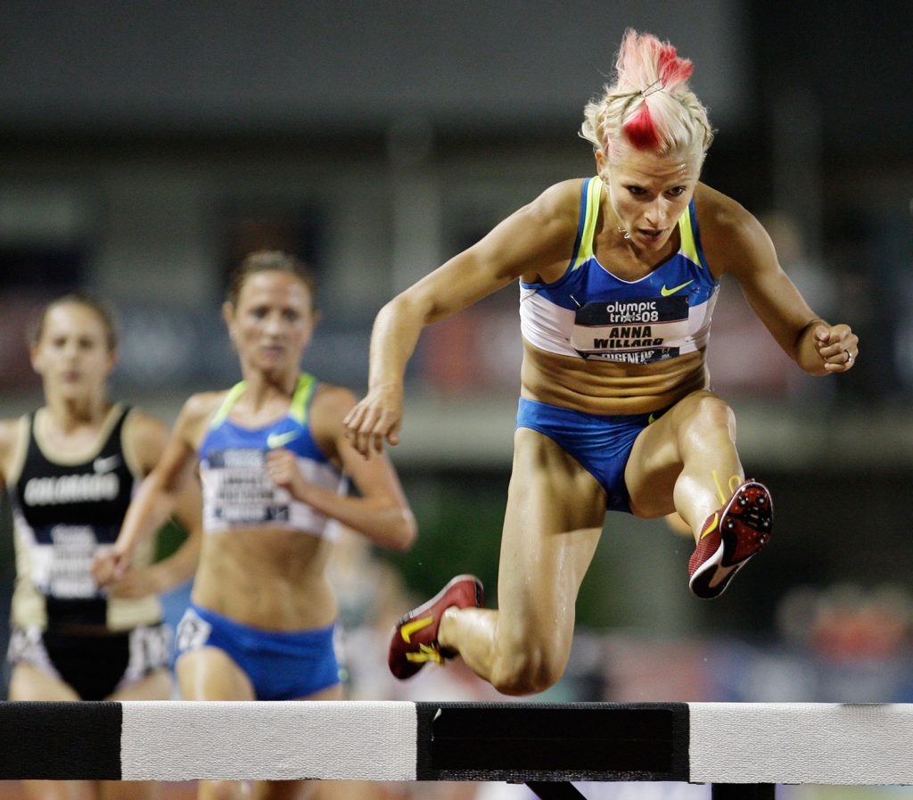 Anna Willard goes over the last barrier to win the women's 3,000-meter steeplechase final at the U.S. Olympic Track and Field Trials in Eugene, Ore., in 2008. Willard set an American record with a time of 9:27.59. 