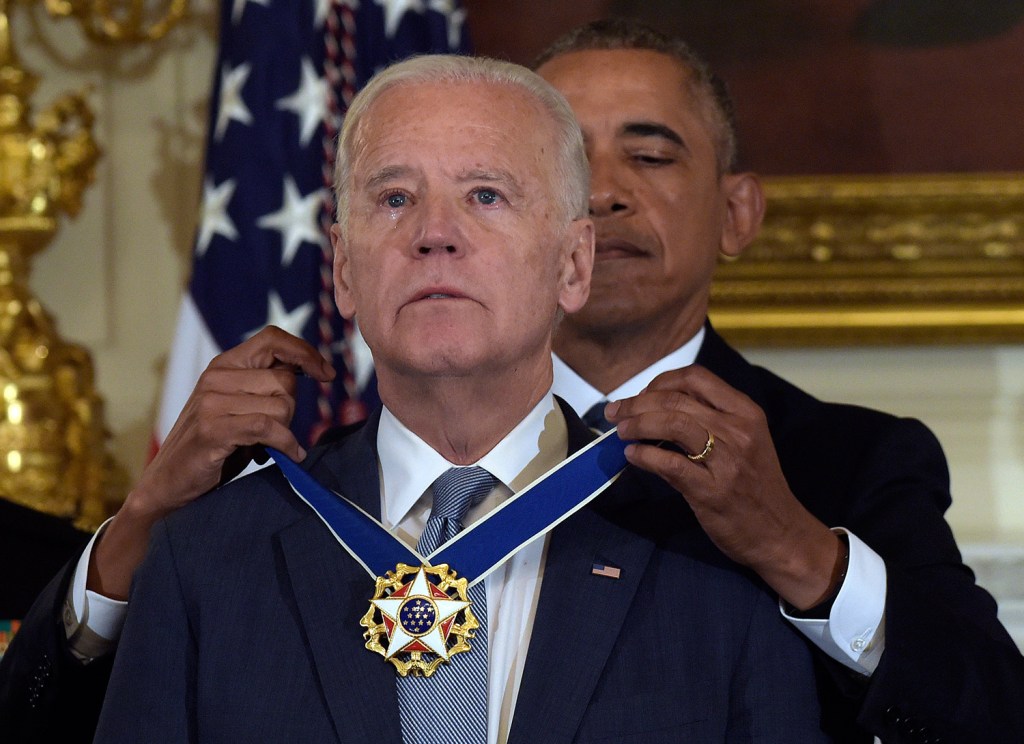 President Barack Obama presents Vice President Joe Biden with the Presidential Medal of Freedom during a ceremony in the State Dining Room of the White House in Washington on Thursday. The award caught Biden by surprise.