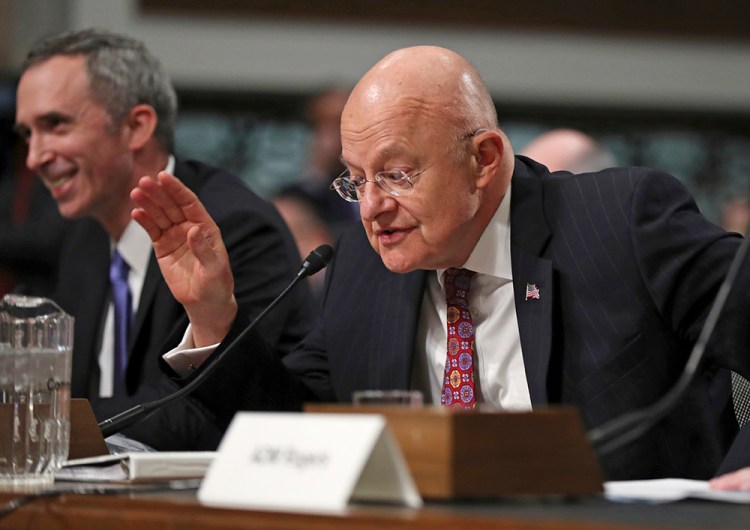 Director of National Intelligence James Clapper, right, with Defense Undersecretary of Defense for Intelligence Marcel Lettre II, testifies on Capitol Hill Thursday before the Senate Armed Services Committee. <em>Associated Press/Manuel Balce Ceneta</em>