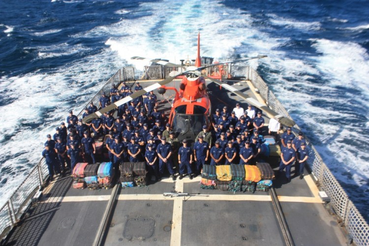 The crew of the U.S. Coast Guard cutter Tahoma, shown with Florida's Helicopter Interdiction Tactical Squadron, is shown last month. The Tahoma has returned to its home port of Kittery.