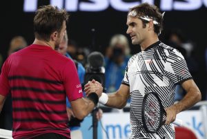 Switzerland's Roger Federer, right, is congratulated by compatriot Stan Wawrinka, after winning their semifinal at the Australian Open.