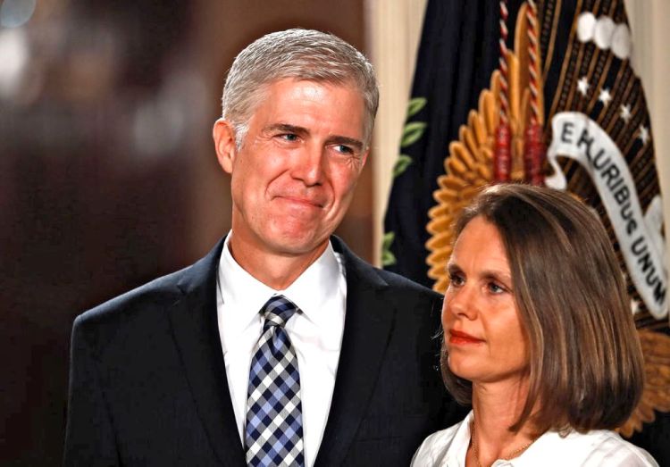 Judge Neil Gorsuch stands with his wife, Louise, as President Trump announces him as his nominee for the Supreme Court. The nominee is expected to face intense scrutiny from Democrats.