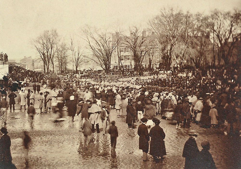 The crowd at Abraham Lincoln's second inauguration shows a rain-soaked street. March 4, 1865.