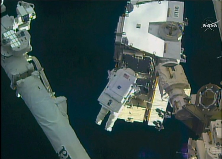 Astronaut Peggy Whitson takes a spacewalk outside the International Space Station on Friday.