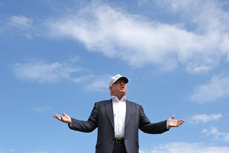 Then-presidential candidate Donald Trump speaks to the media on the golf course at his Trump International Golf Links in Aberdeen, Scotland on June 25, 2016.  Trump got the environmentally sensitive project approved in 2008 after promising to create jobs for local workers. 