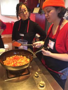 Cara Stadler, right, of Tao Yuan and Bao Bao Dumpling House, takes a shanxi noodle-making class in Beijing.