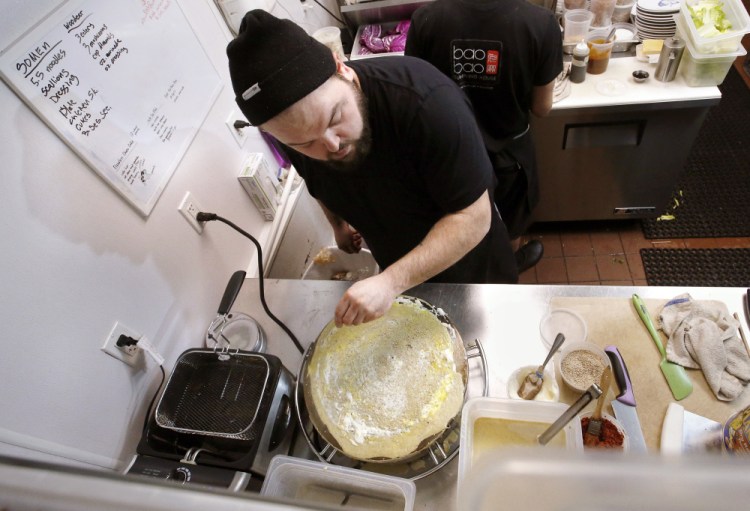 Chef Josh Amergian of Bao Bao Dumpling House prepares jianbing – a popular street food with a crepe-like outer wrap. Amergian recently returned from China, where he developed an affinity for the dish.