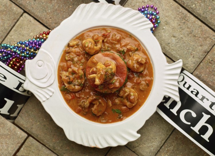 Spinach and roasted pepper tian makes a tasty centerpiece in a bowl of shrimp etouffee.