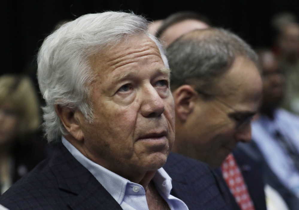 Patriots owner Robert Kraft listens as Commissioner Roger Goodell answers questions at Wednesday's news conference. Kraft, one of the few team owners who attended, left the news conference without answering questions.