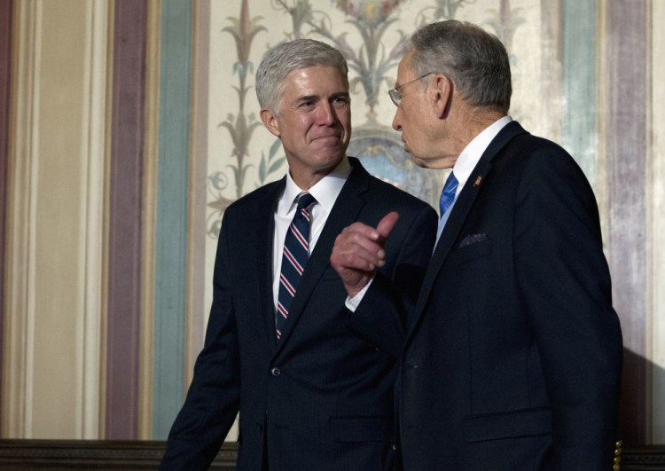Supreme Court nominee Neil Gorsuch, left, meets Wednesday with Senate Judiciary Committee member Chuck Grassley, R-Iowa, on Capitol Hill.