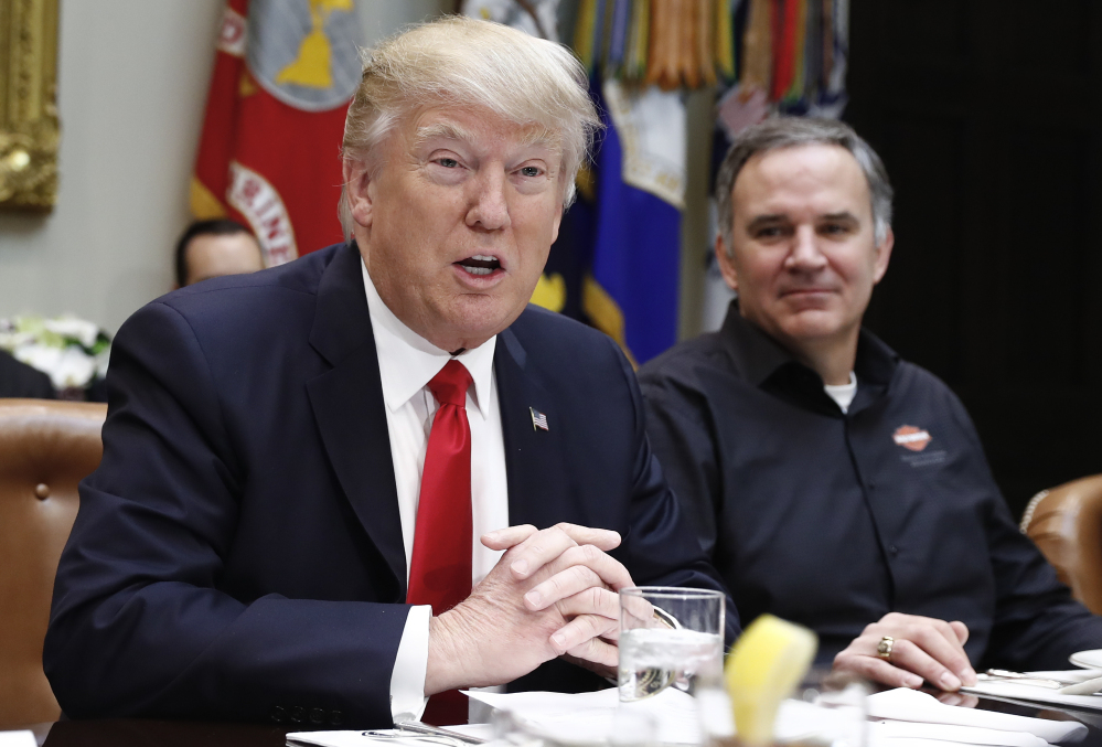 President Trump, joined by Harley-Davidson President and CEO Matt Levatich, talks to the media Thursday before a lunch meeting with Harley-Davidson executives and union representatives in the Roosevelt Room of the White House.