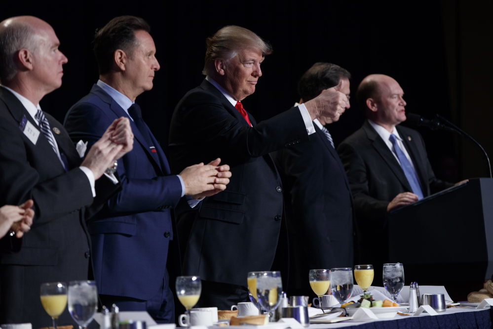 President Trump gives a thumbs up during the National Prayer Breakfast on Thursday in Washington. If he finalizes a draft executive order creating religion-based exemptions to federal anti-bias policies, it would be another victory for the conservative Christians who flocked to the polls on Trump's behalf.