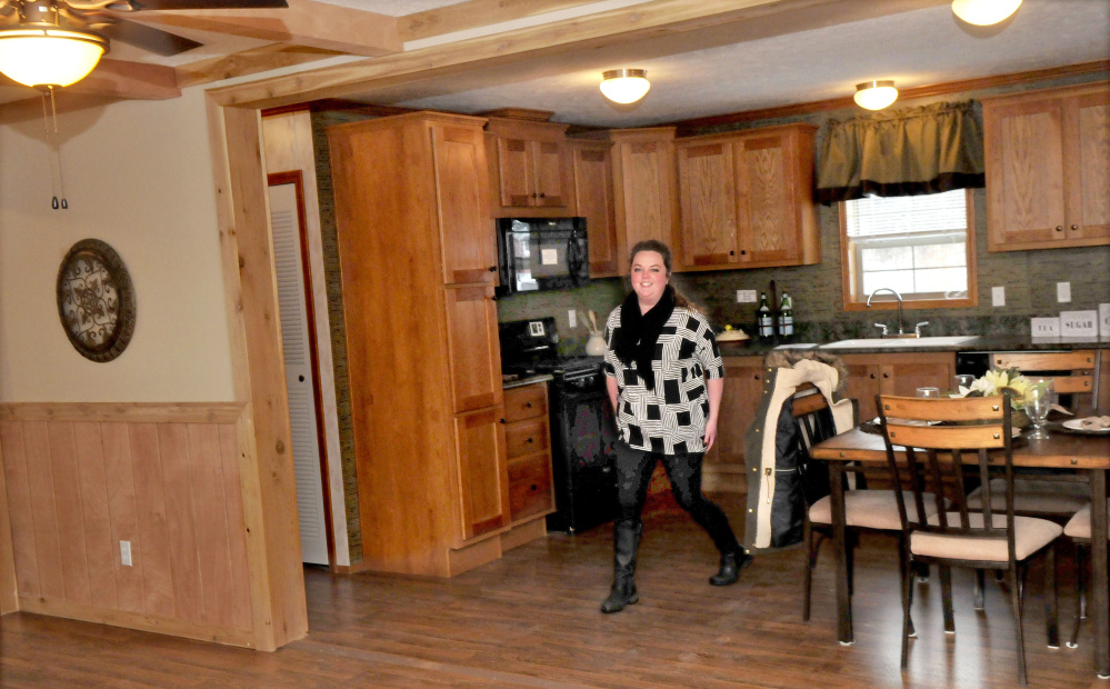 Pine Tree Homes Vice President and Winslow Town Councilor Patricia West walks through the kitchen area of a manufactured home Wednesday at the business in Winslow. The council has voted to allow mobile homes in more zones to address a housing shortage.