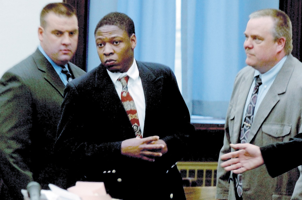 Daniel L. Fortune, center, at the Somerset County Superior Court in Skowhegan in 2010. He is looking to appeal a unanimous ruling that affirmed his life sentences in an attack that nearly killed a girl and her father