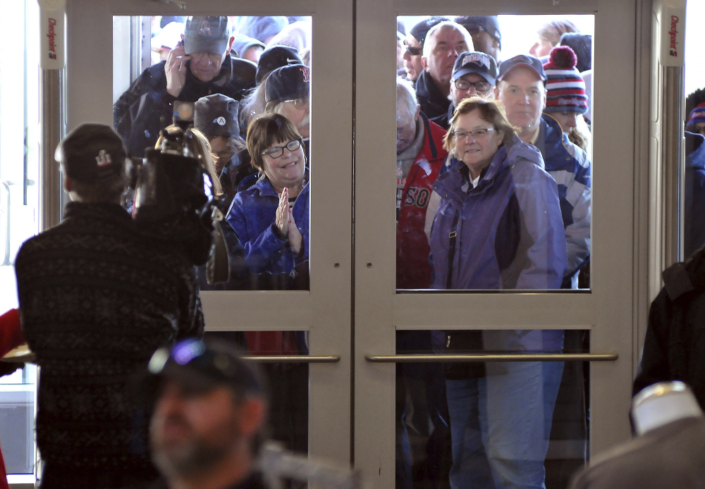 New England Patriots fans wait to get into the Pro Shop at Gillette Stadium in Foxborough, Mass., Monday, Feb. 6, 2017. The shop opened at 6 a.m. the morning after the Patriots defeated the Atlanta Falcons in Super Bowl LI. (Mark Stockwell/The Sun Chronicle via AP)