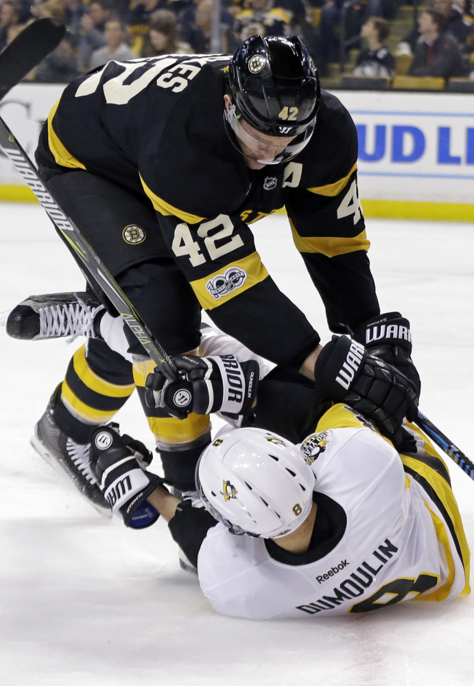 Boston's David Backes, top, had a great playoff for the St. Louis Blues last season, but he's scuffling for the Bruins right now. "I'm fighting it a little bit, no question," he admits.