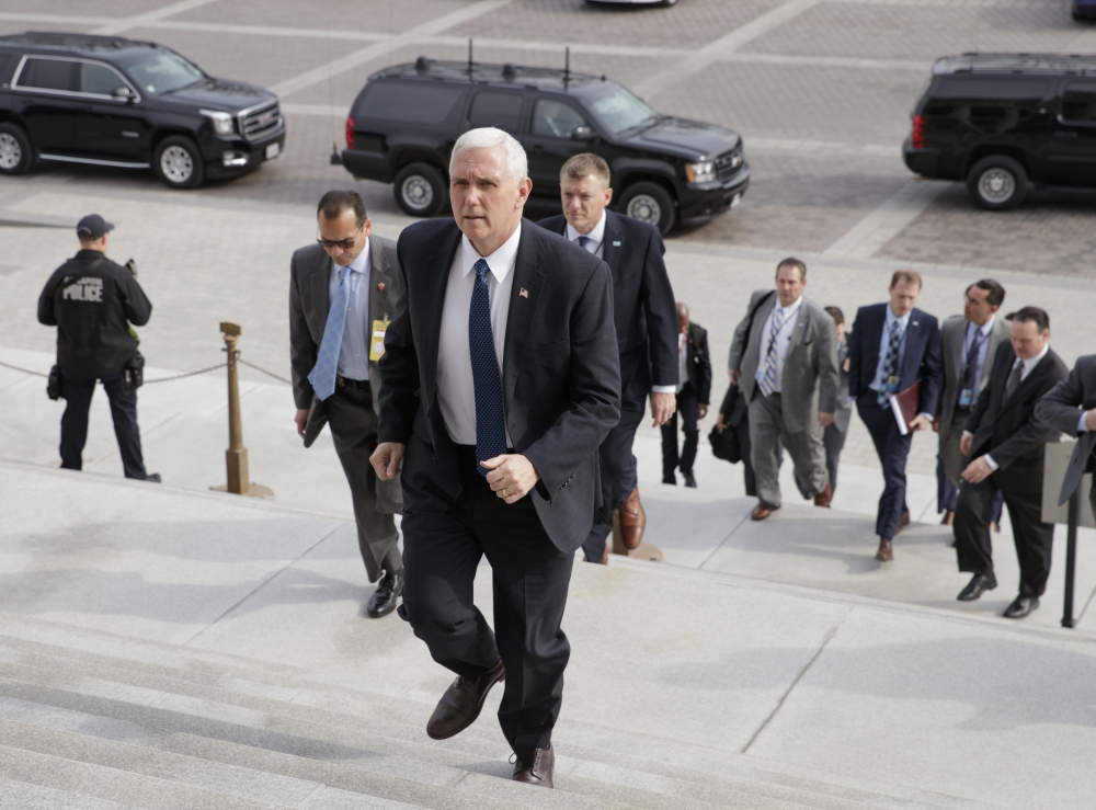 Vice President Mike Pence arrives Tuesday at the Senate as he prepares to cast the tie-breaking vote for Betsy DeVos as education secretary.