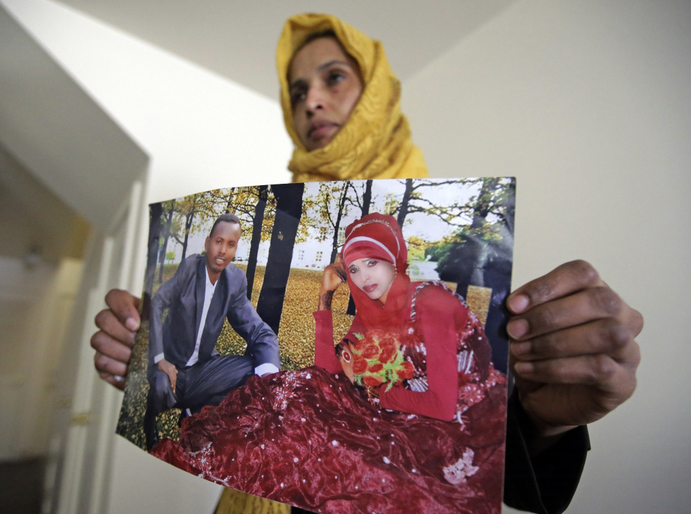 Somali refugee Nimo Hashi, who lives in Salt Lake City, holds a photo of her husband – one of the hundreds of people left in limbo by a ban on travelers from Somalia and six other Muslim-majority countries. President Trump says the order is aimed at protecting Americans from terrorists, even though no fatal attack has been linked to immigrants from the seven targeted nations.
