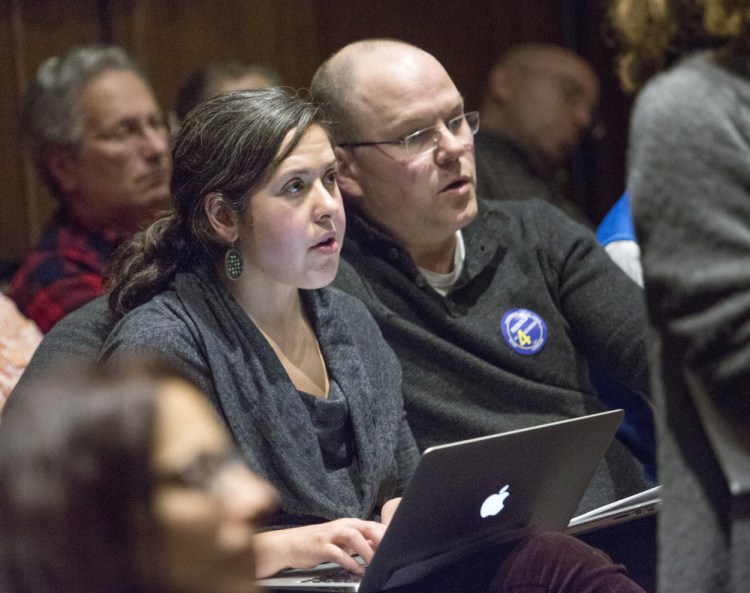 Emily Figdor and Steven Biel attend a public hearing on proposals for funding the renovation of Portland's elementary schools. They have coordinated aggressive lobbying campaigns to push a $61 million school bond.