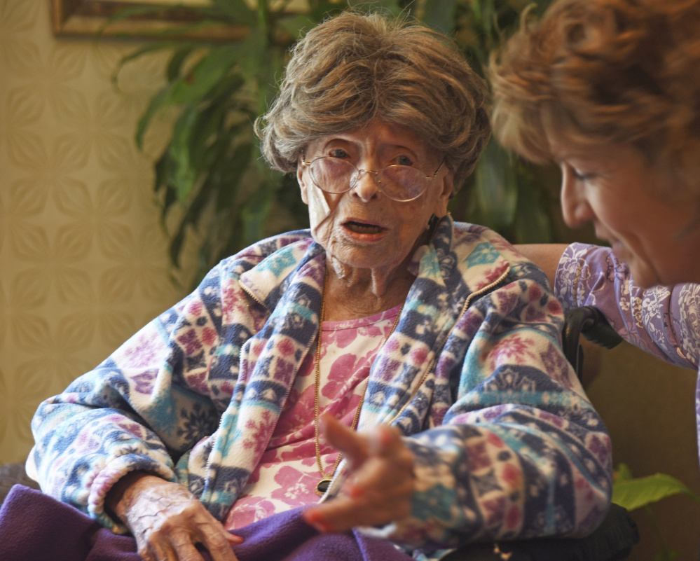 Adele Dunlap, then 113, talks with Susan Dempster, the activities director at the Country Arch Care Center in Pittstown, N.J., in 2016. Dunlap died Sunday at age 114.