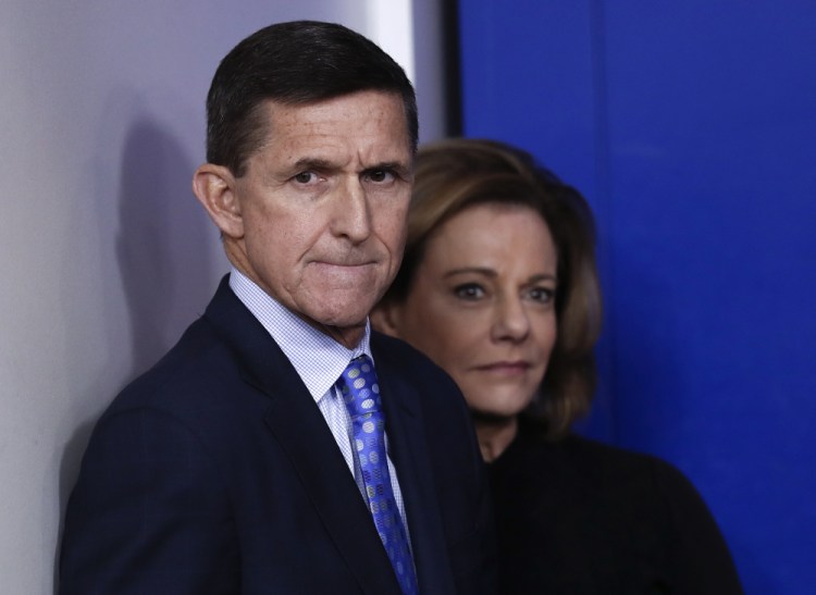 Michael Flynn stands with K.T. McFarland, deputy national security adviser, at a news briefing at the White House this month. He resigned Monday night amid controversy over his discussions with a Russian ambassador.
