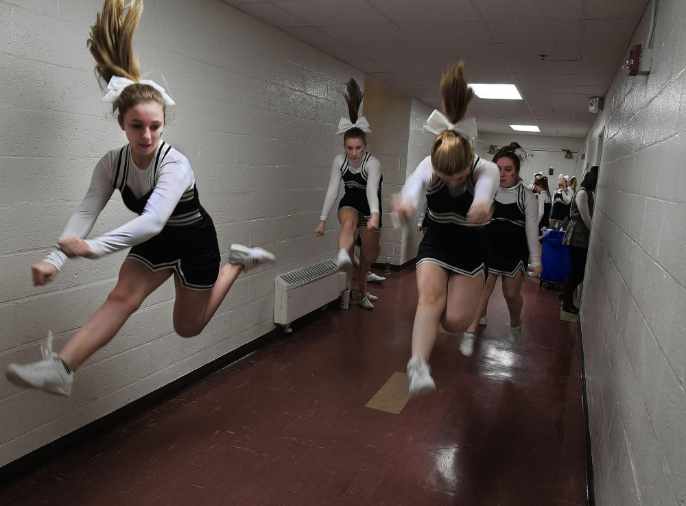 Members of the East Millinocket-Medway Competition Cheer Squad warm up in a Schenck High School hallway before a basketball game. Rural schools like Schenck are wondering how – and whether – they'll survive under a federal Education Department focused on school choice.