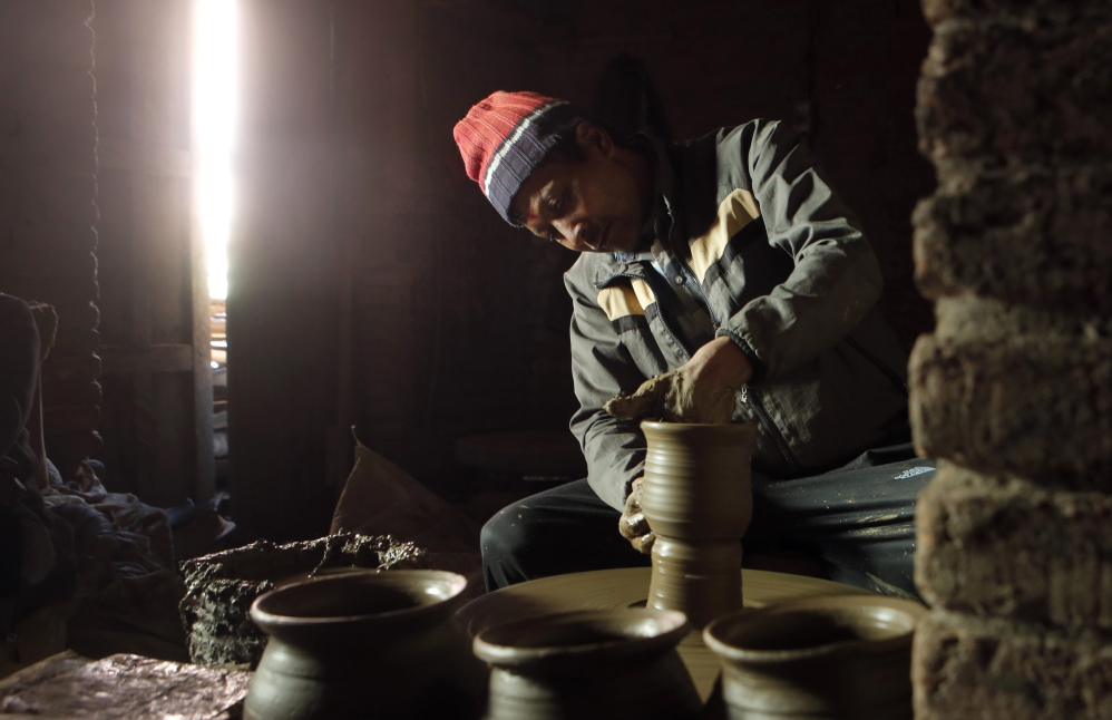 Dil Krishna Prajapati, 54, moulds a clay pot in Thimi. "Times have changed, new products have flooded the market, and people from potter caste love other lucrative professions. I fear that the tradition will fade away," says Dil Krishna.