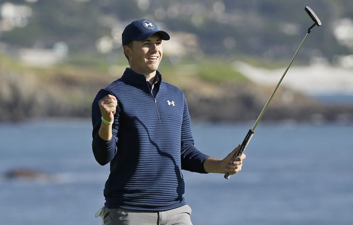 Jordan Spieth celebrates on the 18th green at Pebble Beach after winning the AT&T Pebble Beach National Pro-Am on Sunday. Spieth finished four shots ahead of Kelly Kraft.