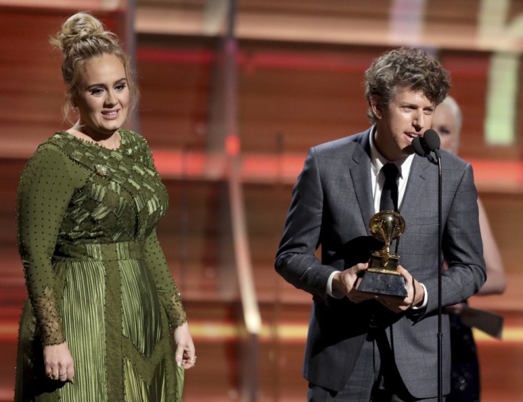 Greg Kurstin, right, and Adele accept the award for song of the year for "Hello" at the 59th annual Grammy Awards on Sunday in Los Angeles.
Matt Sayles/Invision/AP